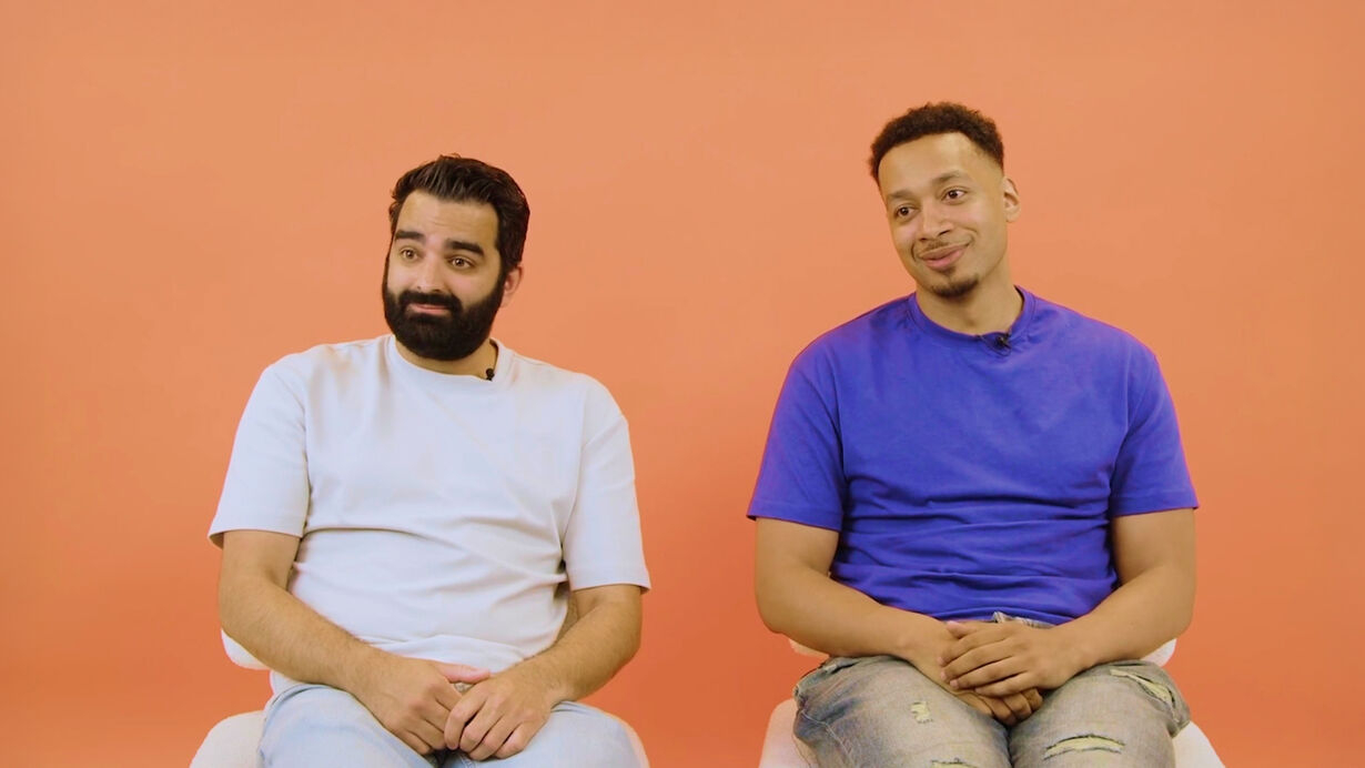 The two hosts of Luke and Pete Talking Sheet seated against an orange background in Spotify’s case-study interview.