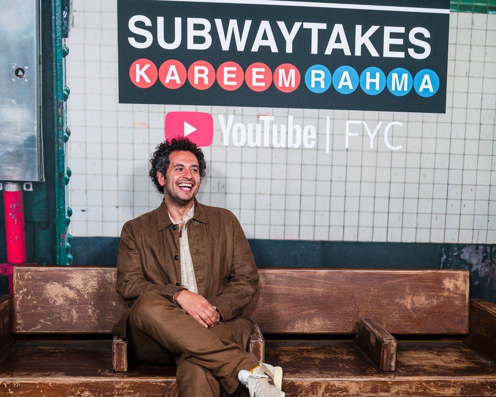 Kareem Rahma seated at a YouTube FYC event beneath a SubwayTakes sign